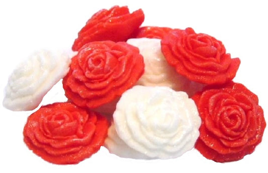 A collection of handmade edible glittered rose cupcake toppers in Red and White colors