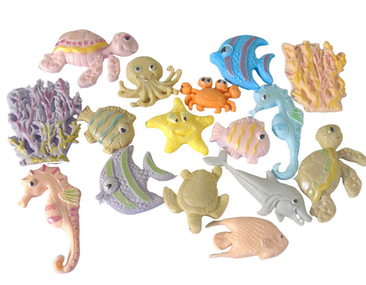 Set of colorful edible sea creature figurines on a white background