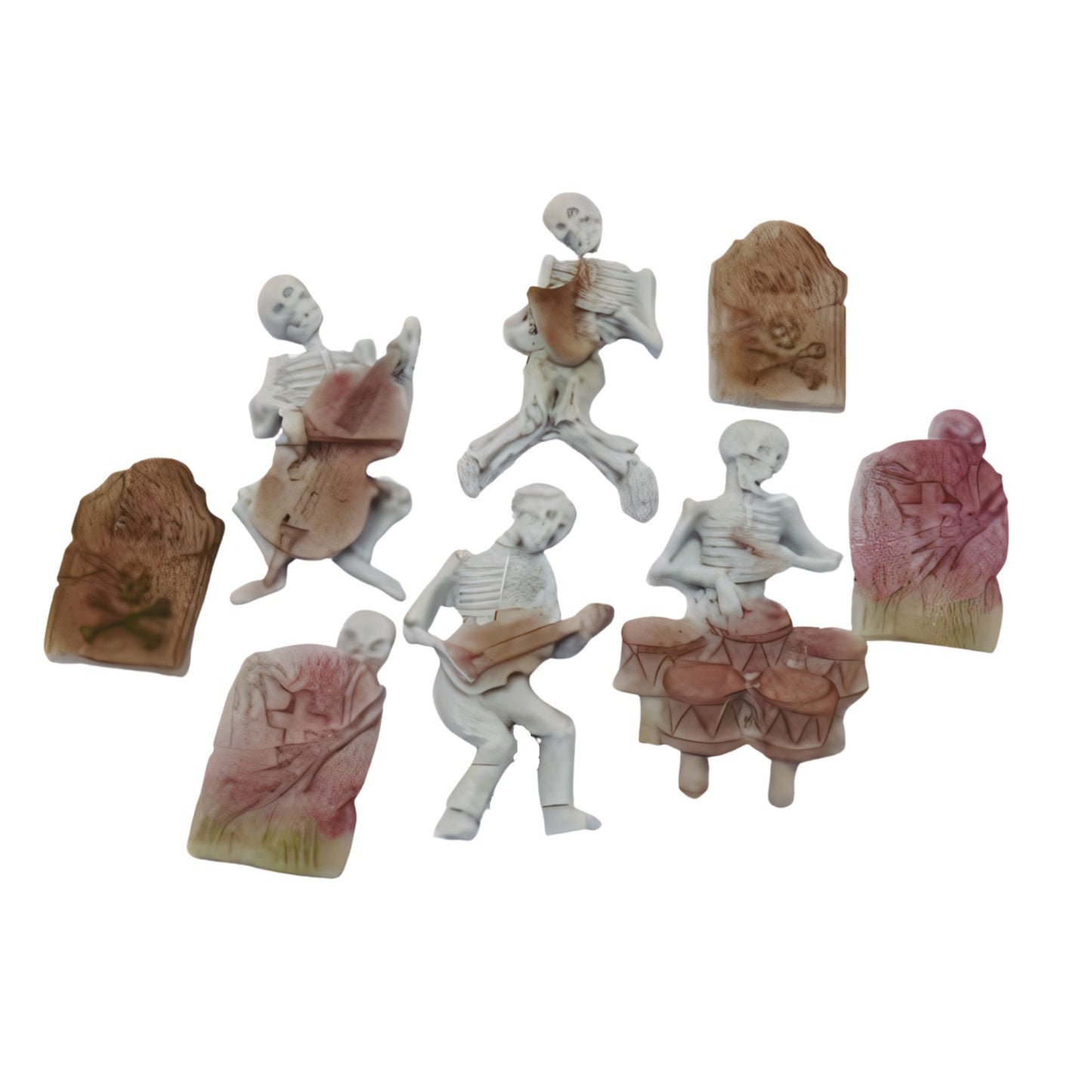 Set of miniature skeletons and tombstones cake decorations shown on a white background