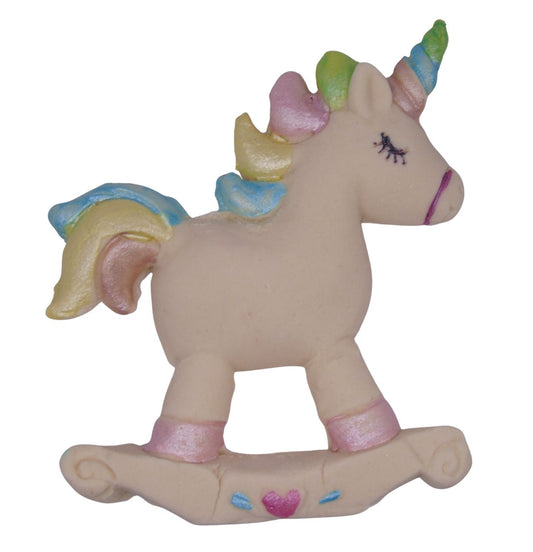 Cream Unicorn-shaped cake decoration on a white
