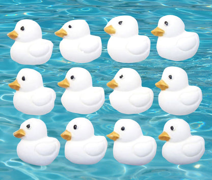 12 white ducks cupcake toppers image shows them on water
