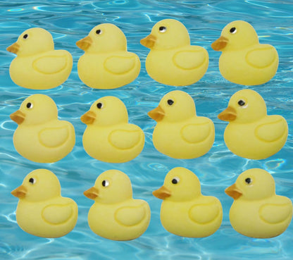 12 yellow ducks cupcake toppers image shows them on water