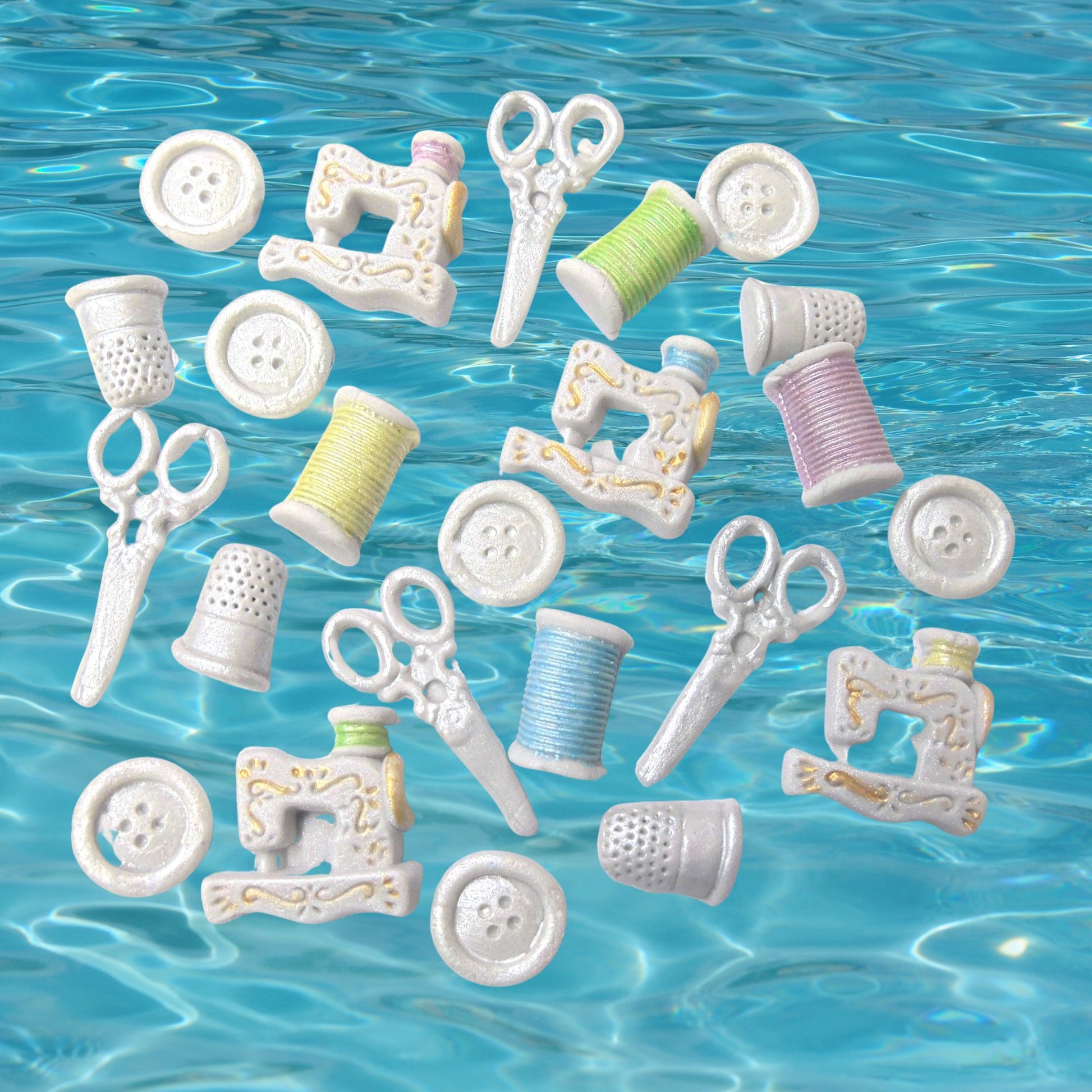 Set 24 handmade vegan sewing kit cupcake topper cake decorations on a blue background