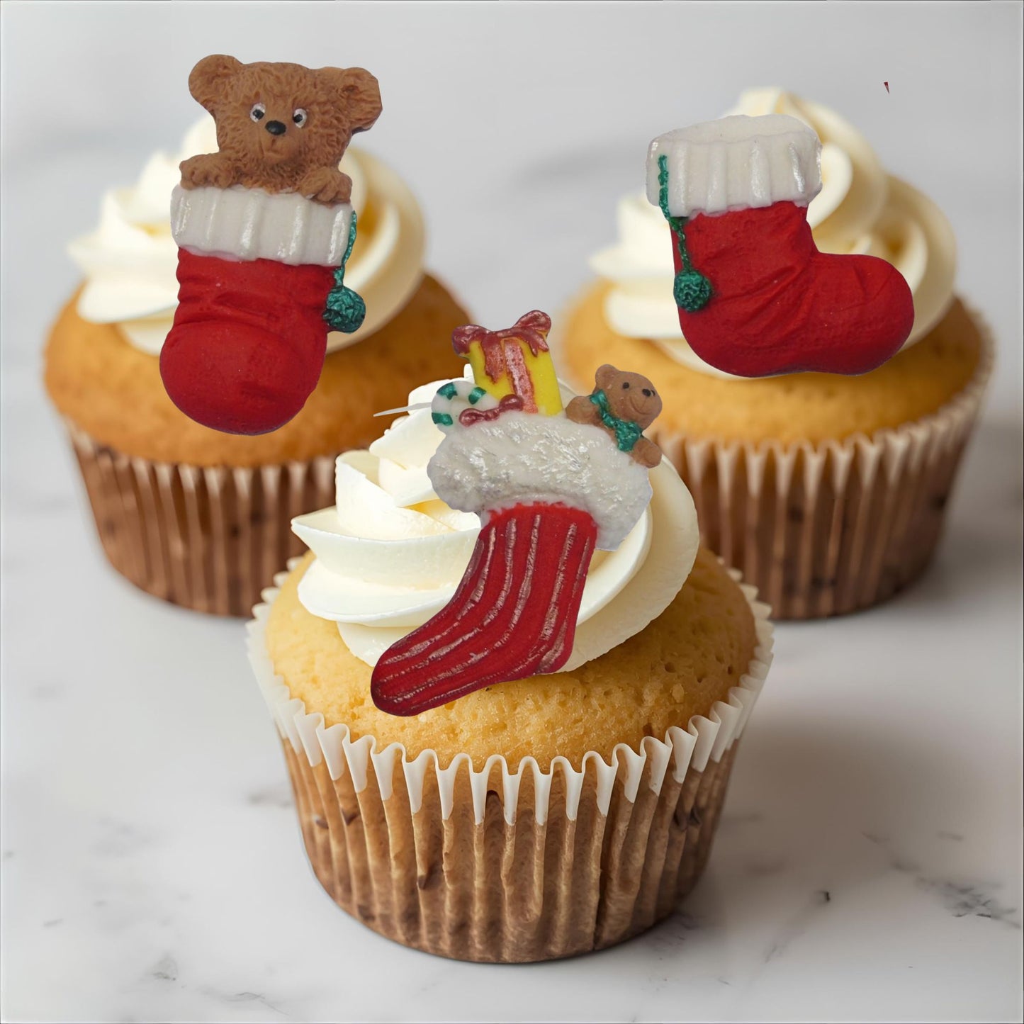 Cupcakes decorated with Christmas-themed  edible toppers 
