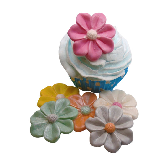 Glittered edible pink flower on a cupcake