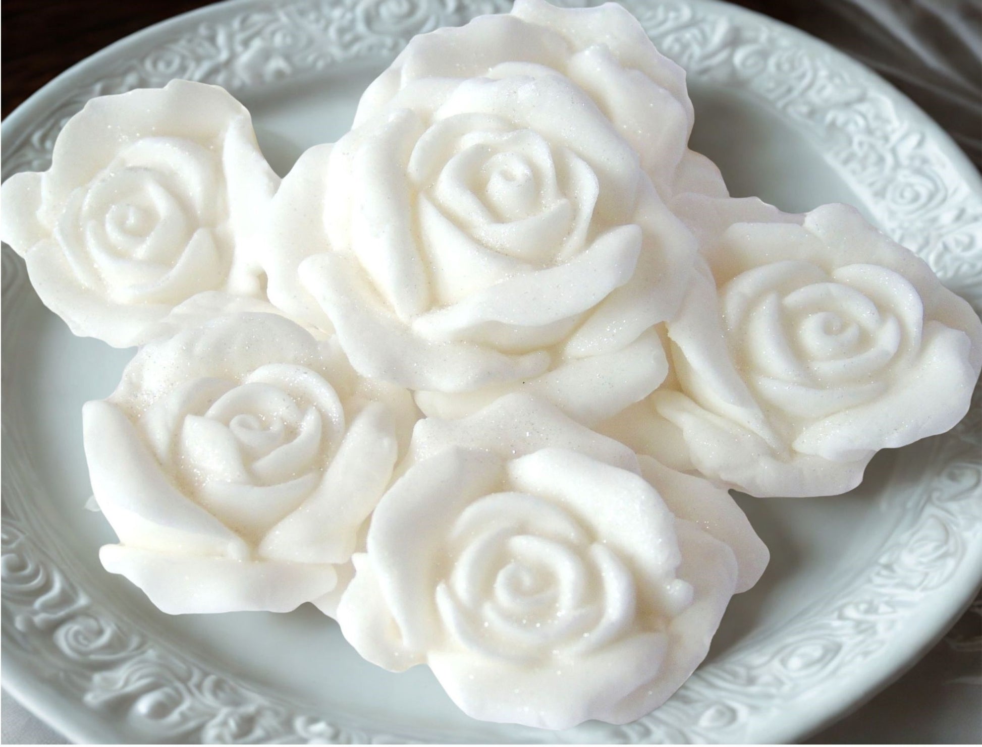 6 White Glittered roses on a plate