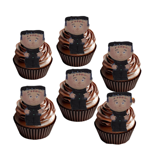 Cupcakes with halloween Monster character toppers on a white background
