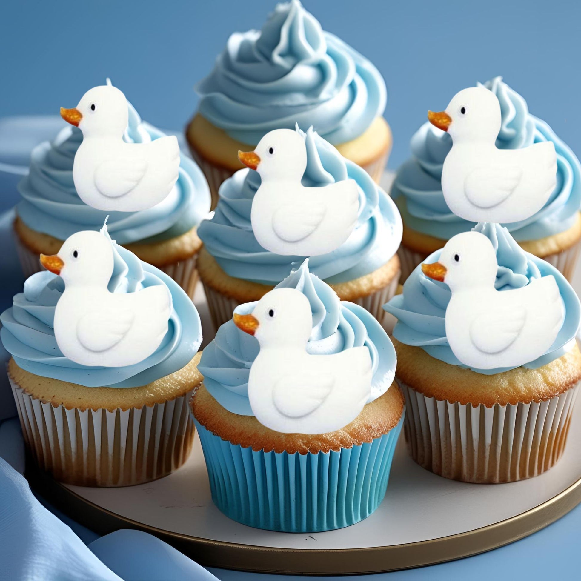cupcake with blue frosting showcasing 6 edible white duck decorations