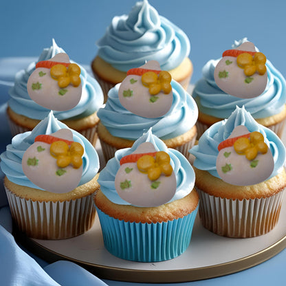 6 Chunky edible baby bottles decorations on blue frosting cupcakes