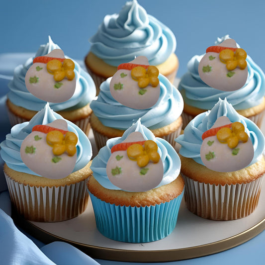 6 Chunky edible baby bottles decorations on blue frosting cupcakes