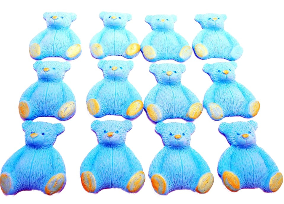 A set of blue edible teddy bear cupcake toppers arranged in rows on a white background
