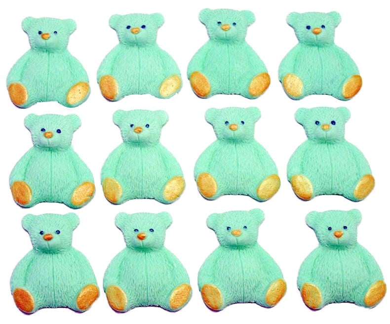 A set of green edible teddy bear cupcake toppers arranged in rows on a white background