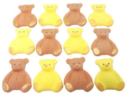 A set of brown and yellow edible teddy bear cupcake toppers arranged in rows on a white background