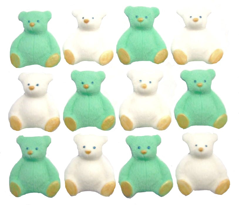 A set of green and white edible teddy bear cupcake toppers arranged in rows on a white background