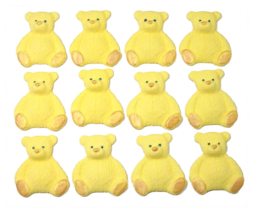 A set of yellow edible teddy bear cupcake toppers arranged in rows on a white background