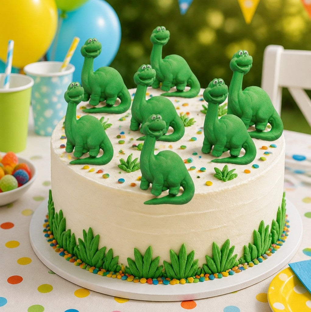 Cake with green nessie figurines on a colorful tablecloth