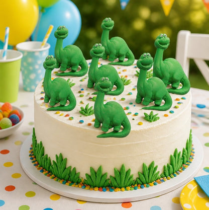 Cake with green nessie figurines on a colorful tablecloth