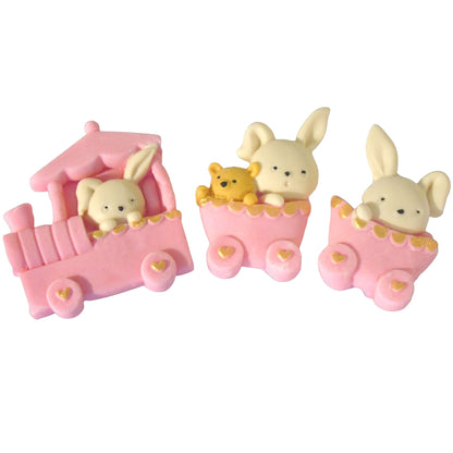 Three small pink carriages with rabbit figures on a white background