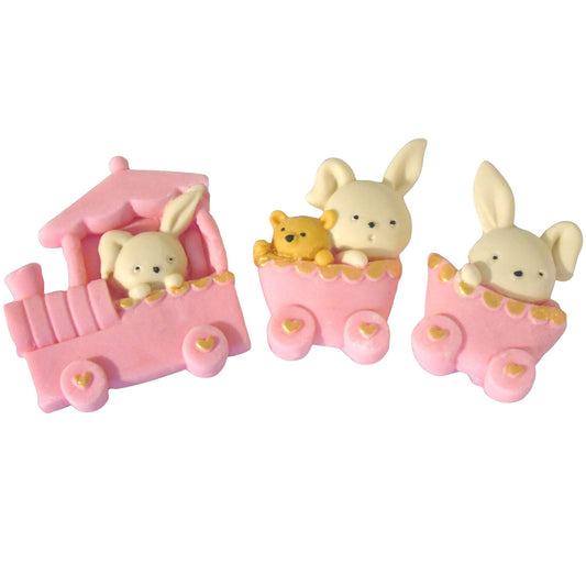 Three small pink carriages with rabbit figures on a white background