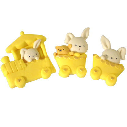 Three small yellow carriages with rabbit figures on a white background
