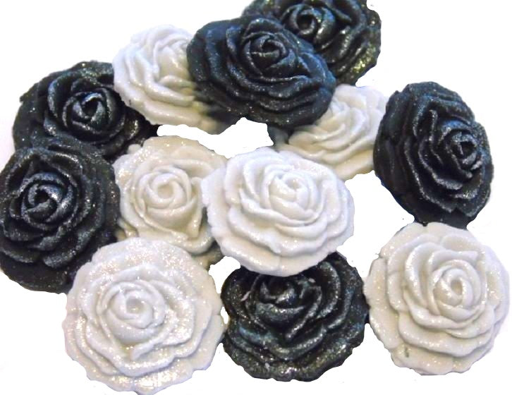 A collection of handmade edible glittered rose cupcake toppers in Black and Silver  colors