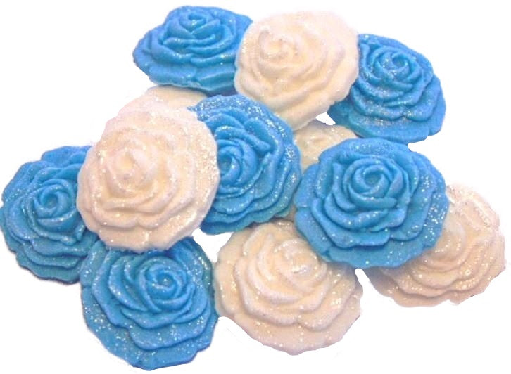 A collection of handmade edible glittered rose cupcake toppers in Blue and White