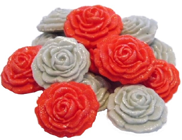 A collection of handmade edible glittered rose cupcake toppers in Red and Silver  colors