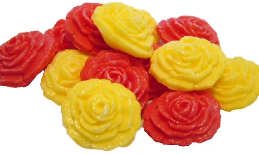 A collection of handmade edible glittered rose cupcake toppers in yellow and Red  colors