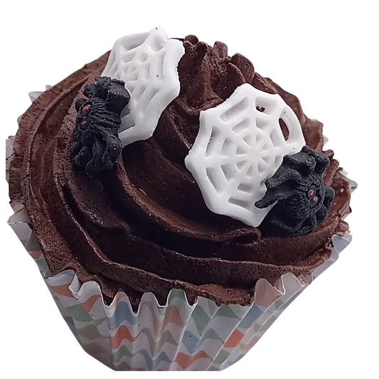 Chocolate cupcake with spiders on webs edible decorations on a white background