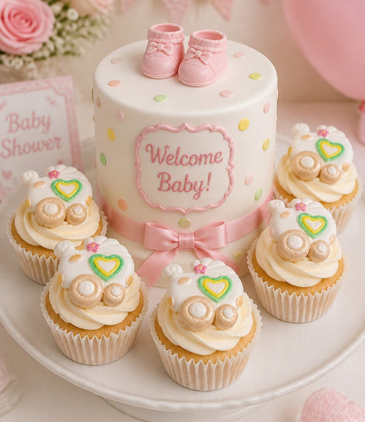 Baby shower cake with cupcakes on a white plate