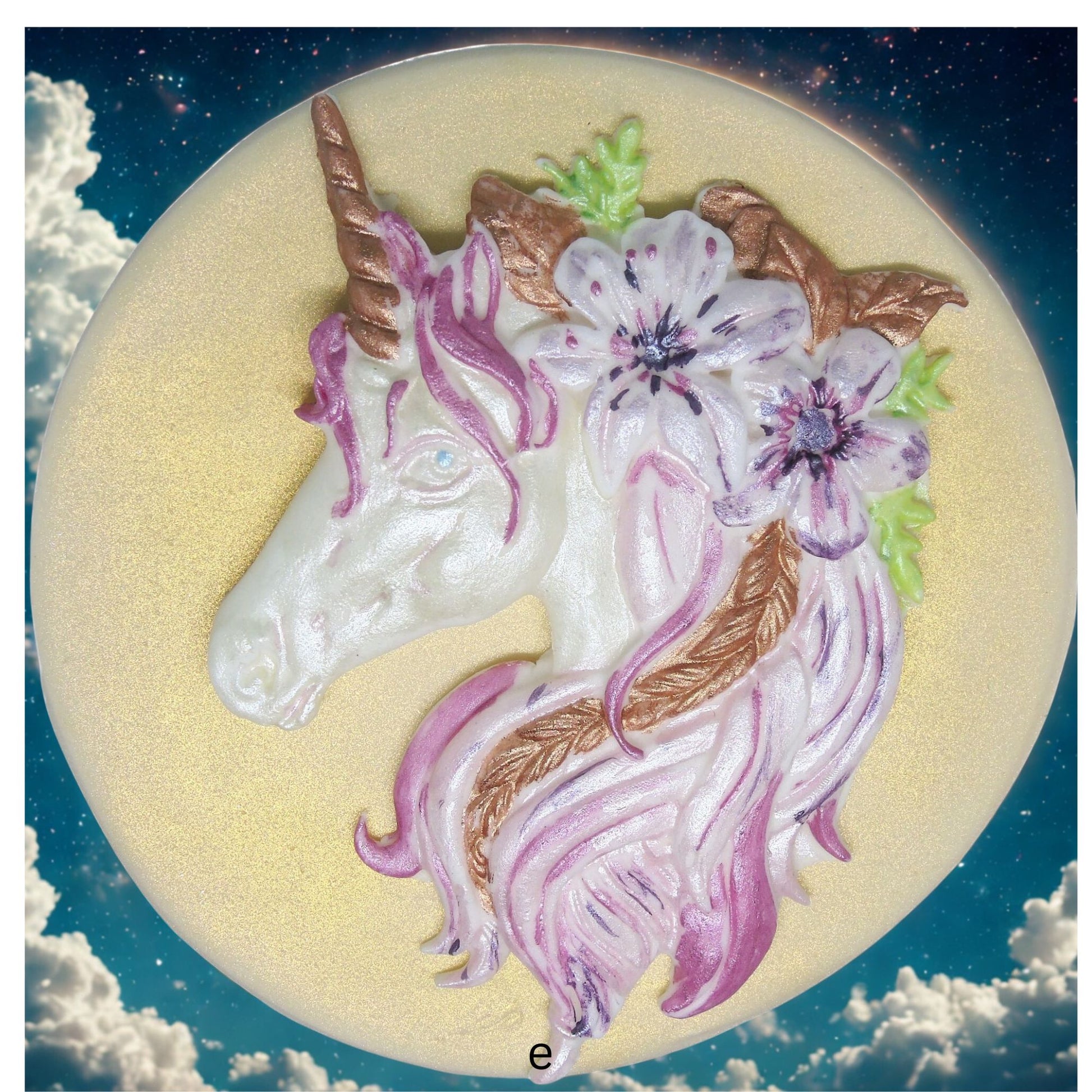 Unicorn with flowers cake decoration on a circular background with cloud background image