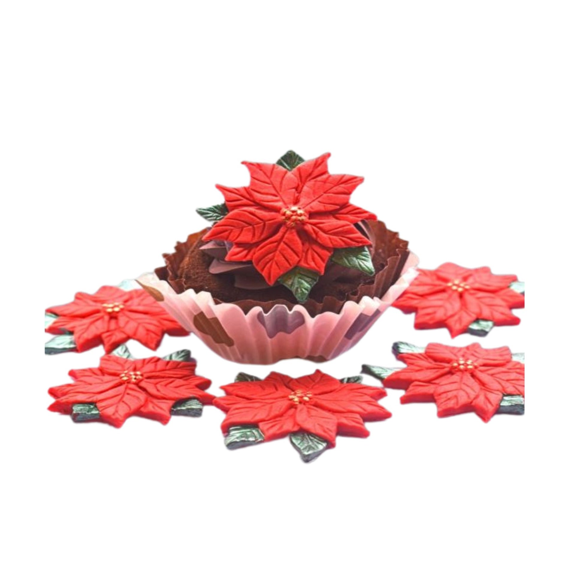 Red poinsettia cupcake toppers on a white background